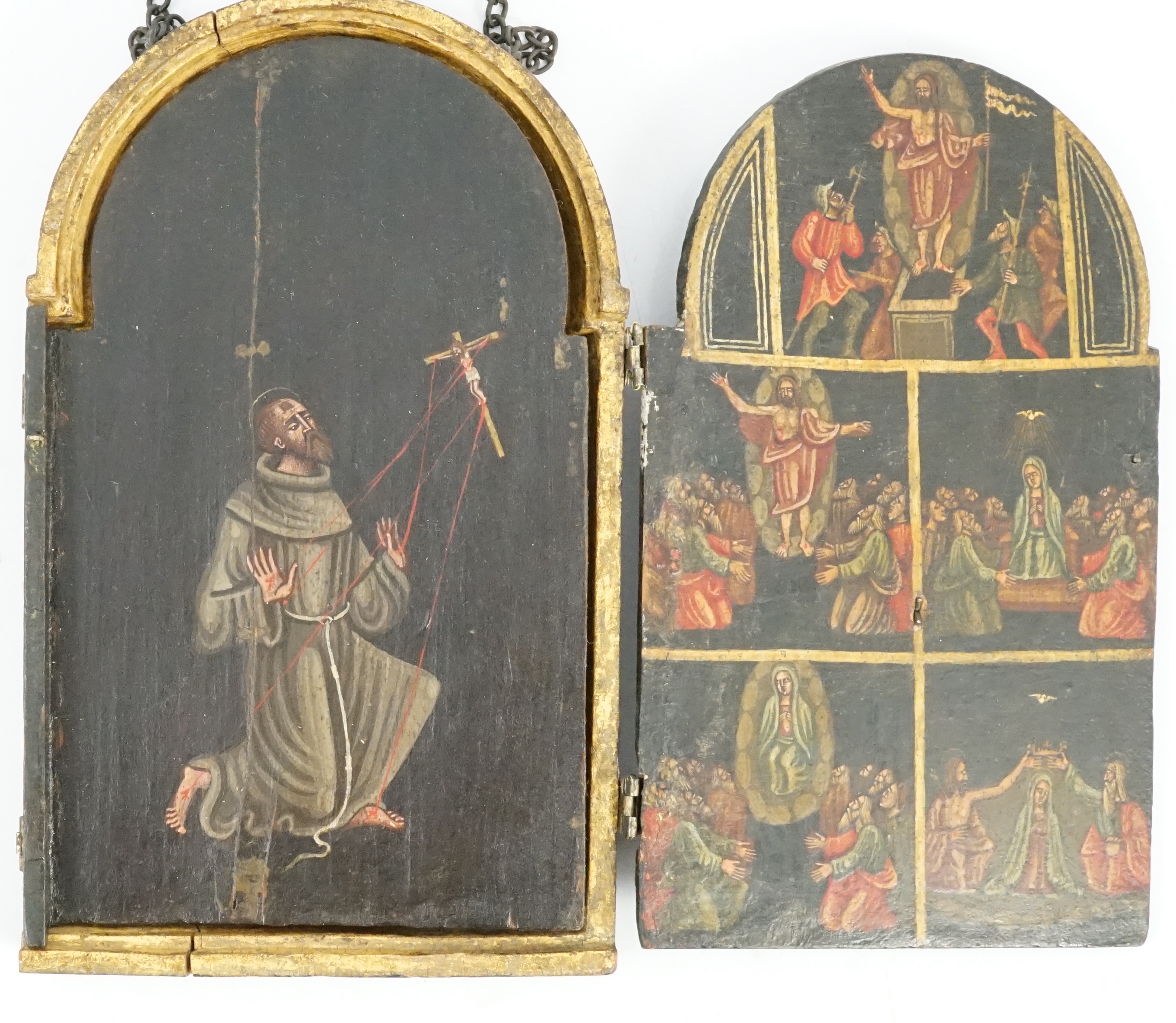 A 17th century triptych case, oil on wood, Icon depicting the life of Christ, with a Saint receiving stigmata on one of the two doors, 11.5cm wide, 18.75cm high, when opened out 33.5cm wide